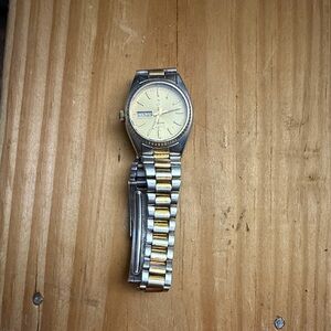Woman’s Silver and Gold Watch